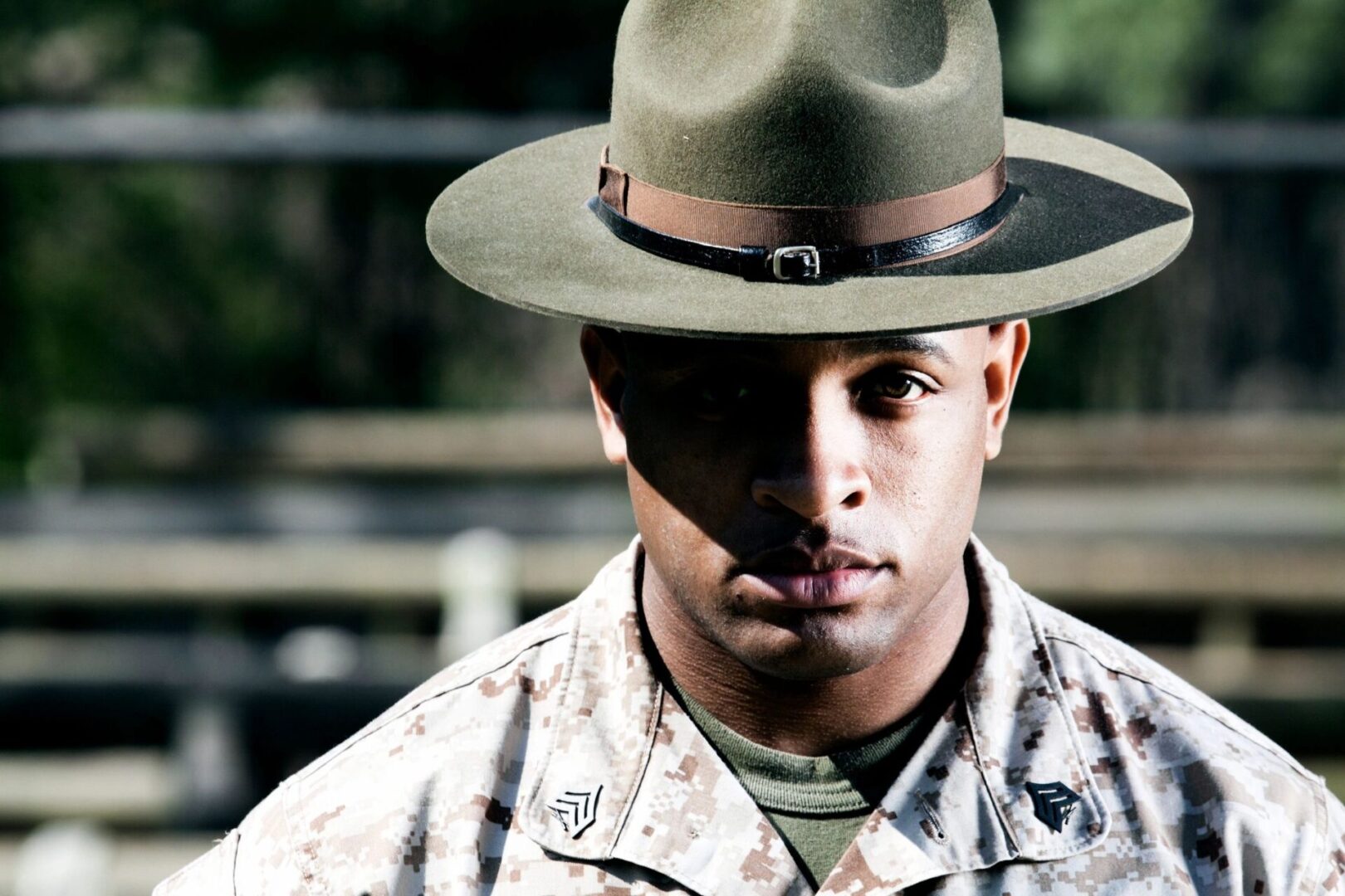 A man in uniform with a hat on.