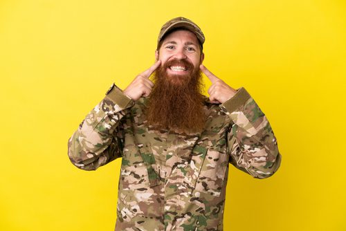 Military,Redhead,Man,Over,Isolated,On,Yellow,Background,Smiling,With